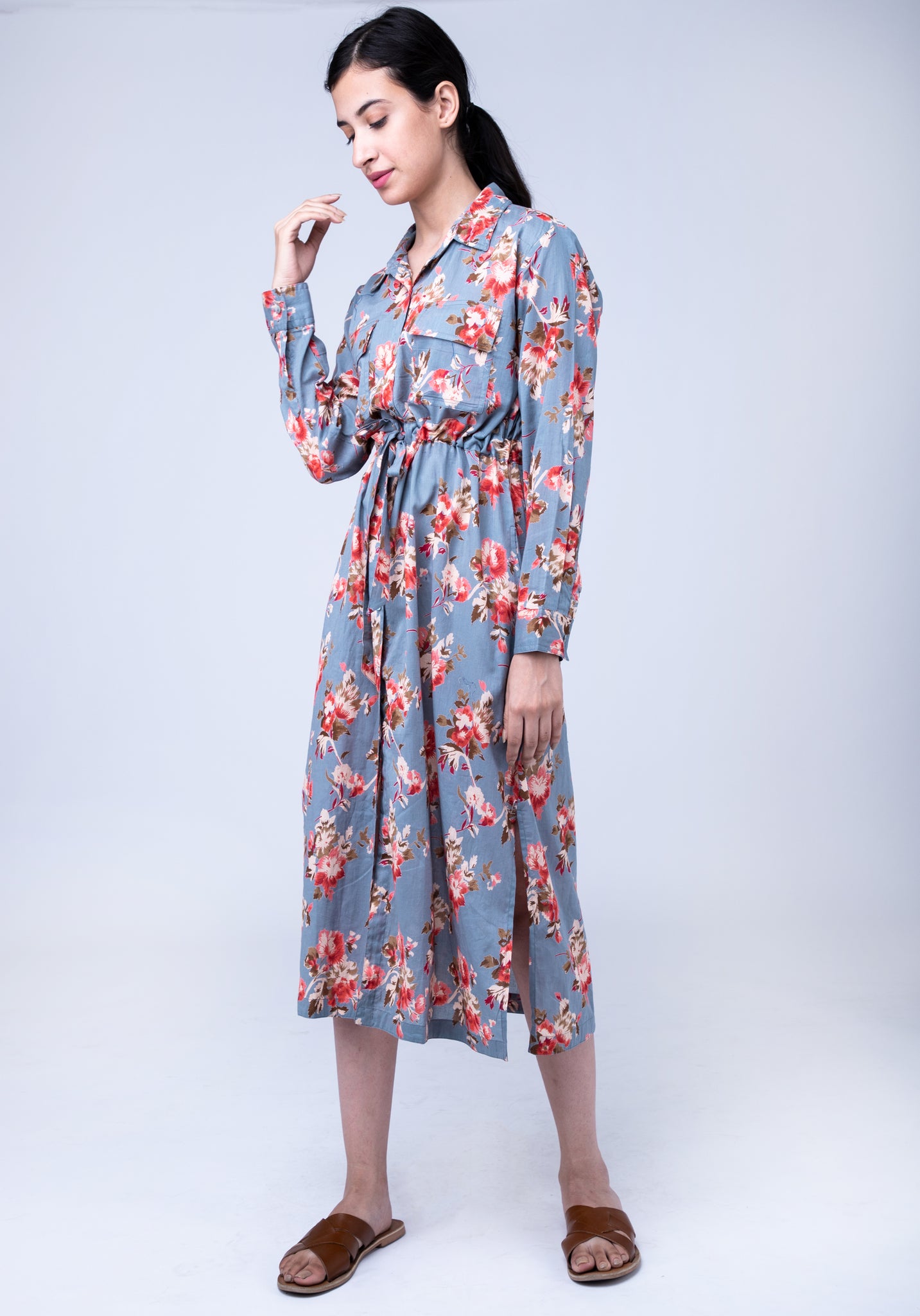 A long shirt dress with patch pockets ...